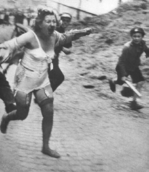 Jewish woman chased by Nazis with clubs in lviv, ukraine, 1941. Photo: Wikimedia Commons